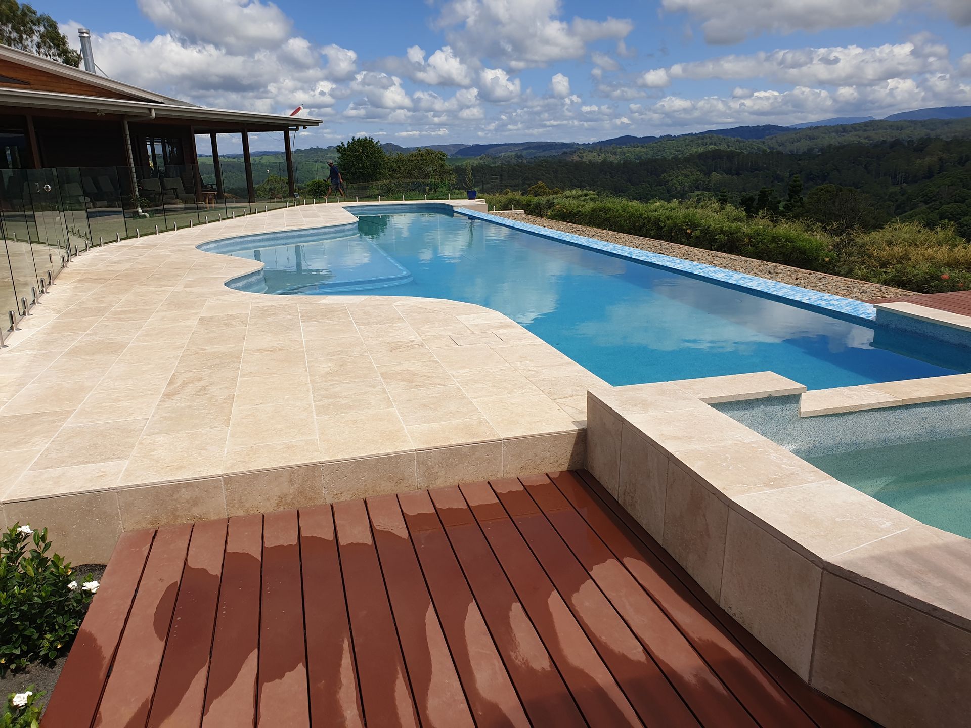 A Large infinity Swimming Pool looking out to a large paddock — Tim Williams Landscapes in Wollongbar, NSW