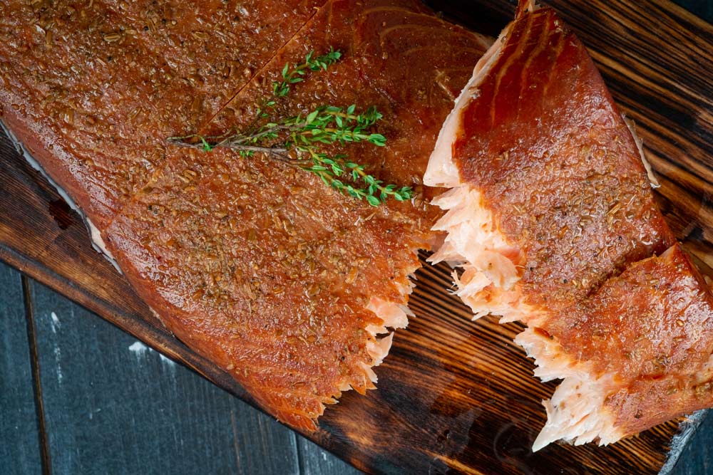 A half-torn piece of smoked salmon fillet