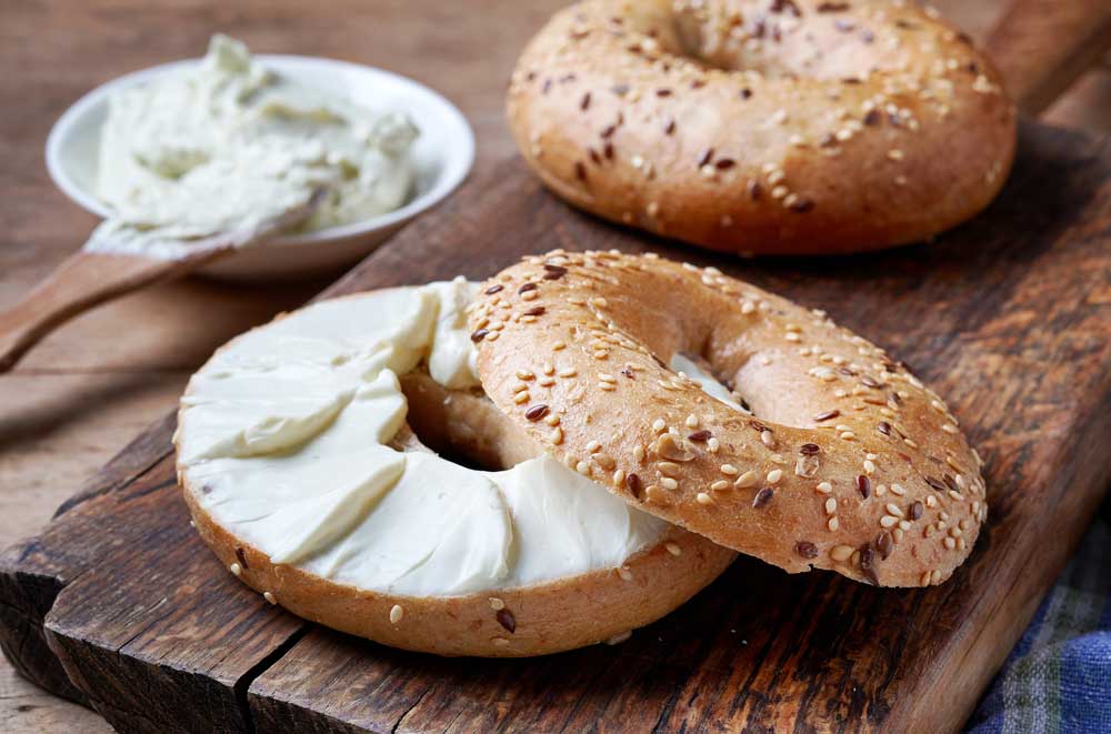 Cream cheese on sliced bagel