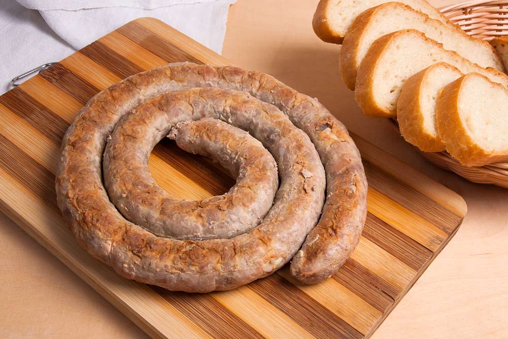 Homemade fried sausages on cutting board