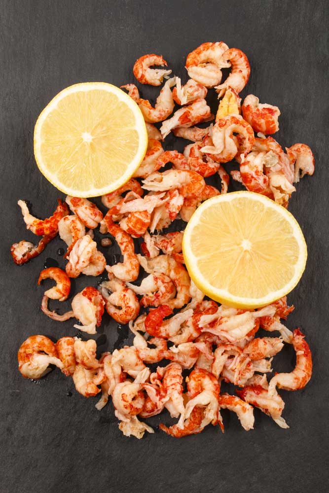 Cleaned and cooked crawfish tails with lemon