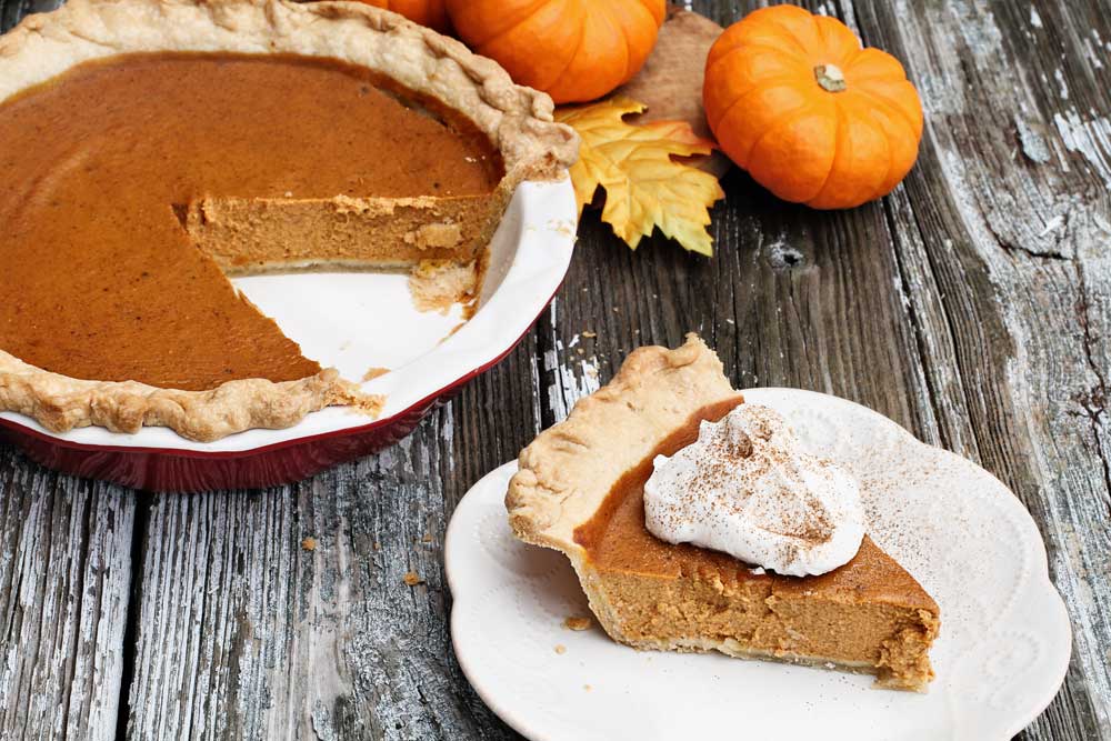 Delicious Pumpkin Pie Slice with Whipped Cream