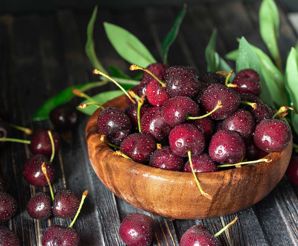 Fresh sweet cherries in bowl