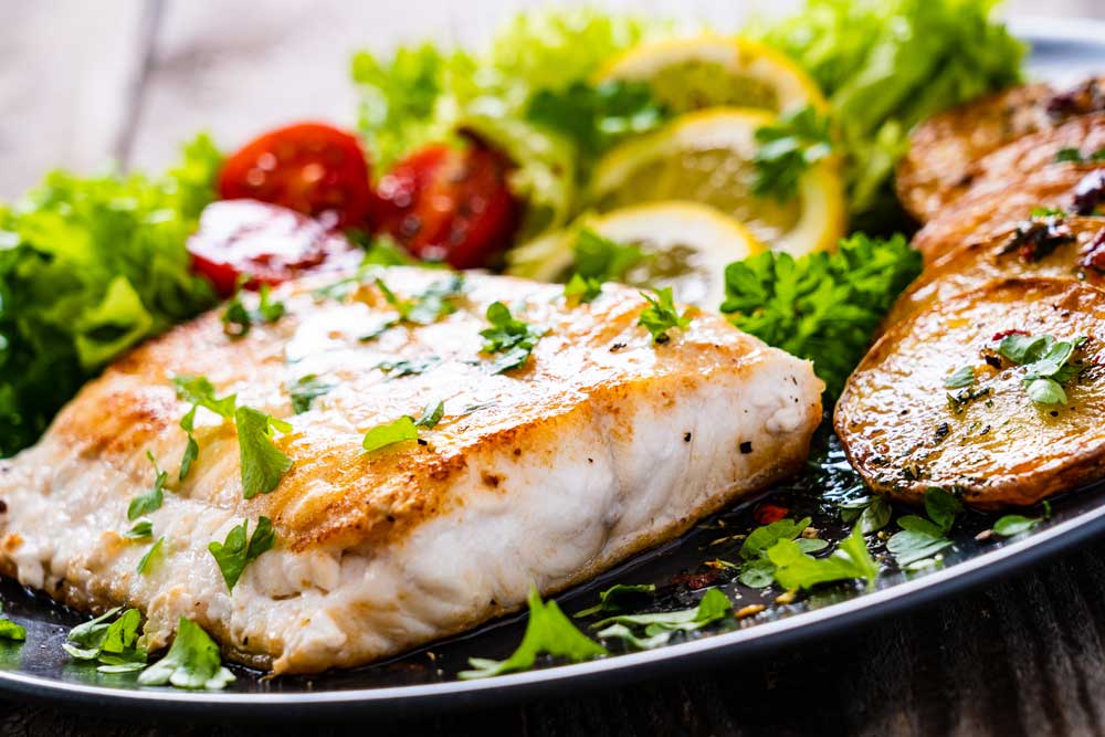 Fried halibut with fresh vegetables
