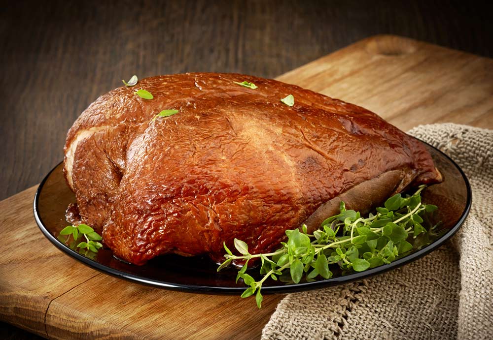 Grilled chicken breast on wooden kitchen table