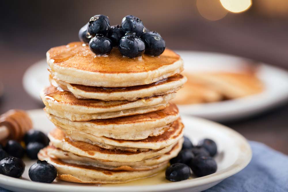 Pancakes with blueberries and syrup