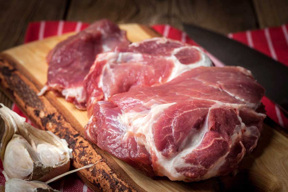 Raw fresh meat on wooden board