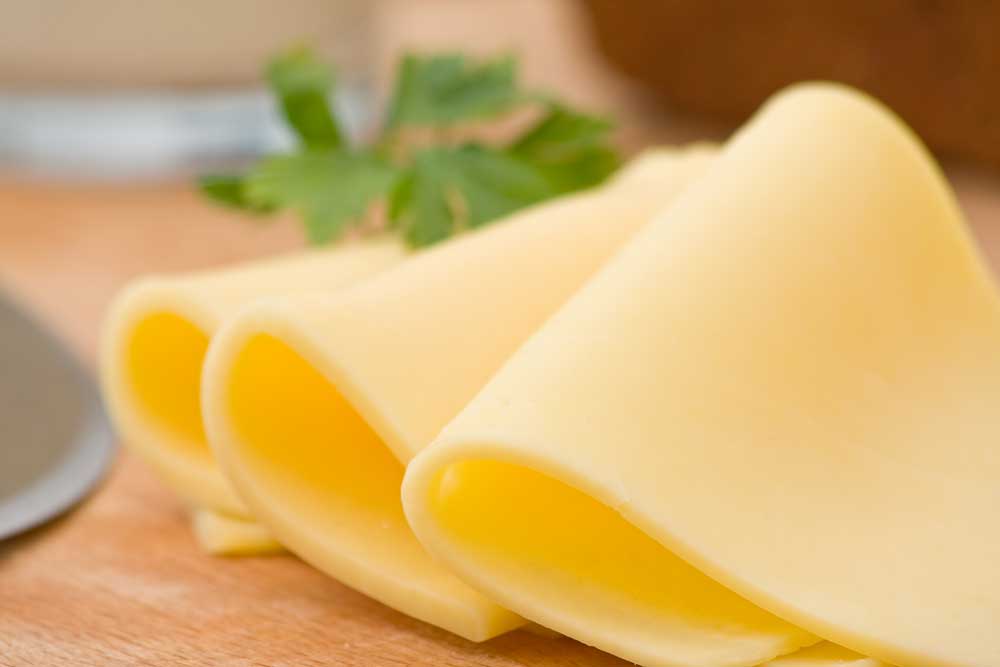 Sliced-delicious-edam-cheese-on-wooden-board
