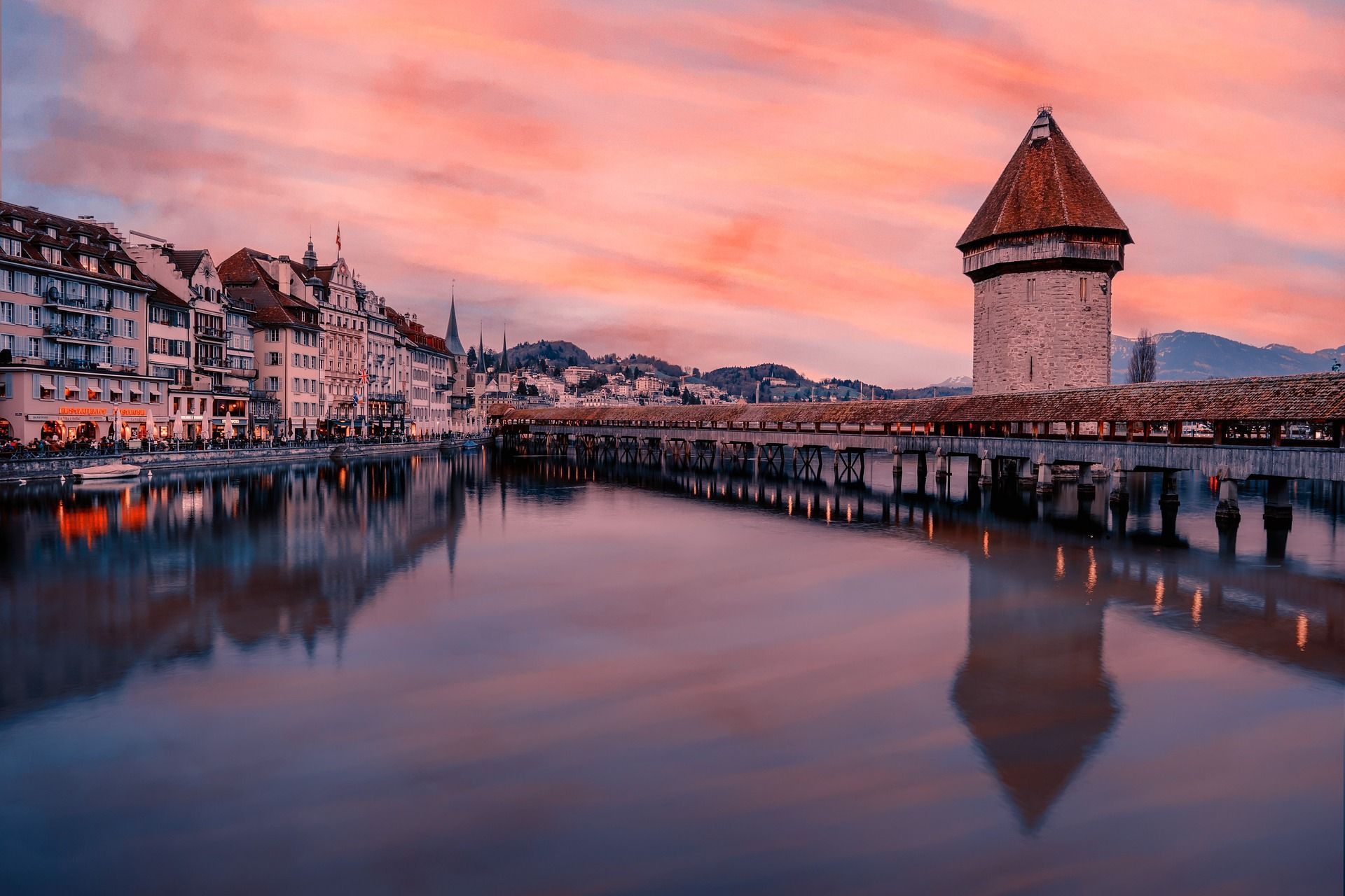 A bridge over a body of water with a tower in the middle of it.