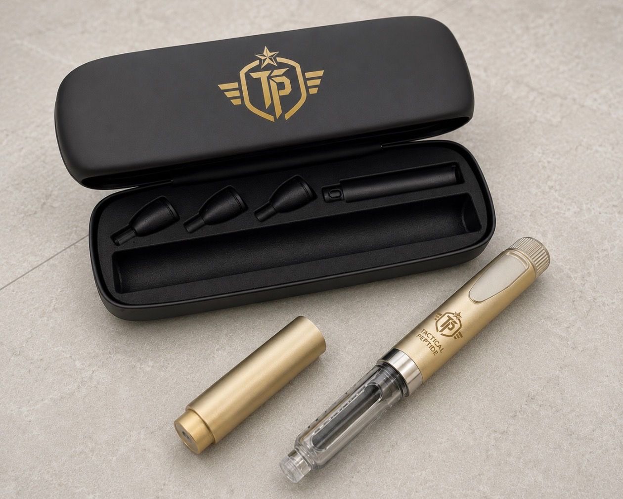Black and gold fountain pen set in a black case, with cap and nib parts laid out on a beige surface