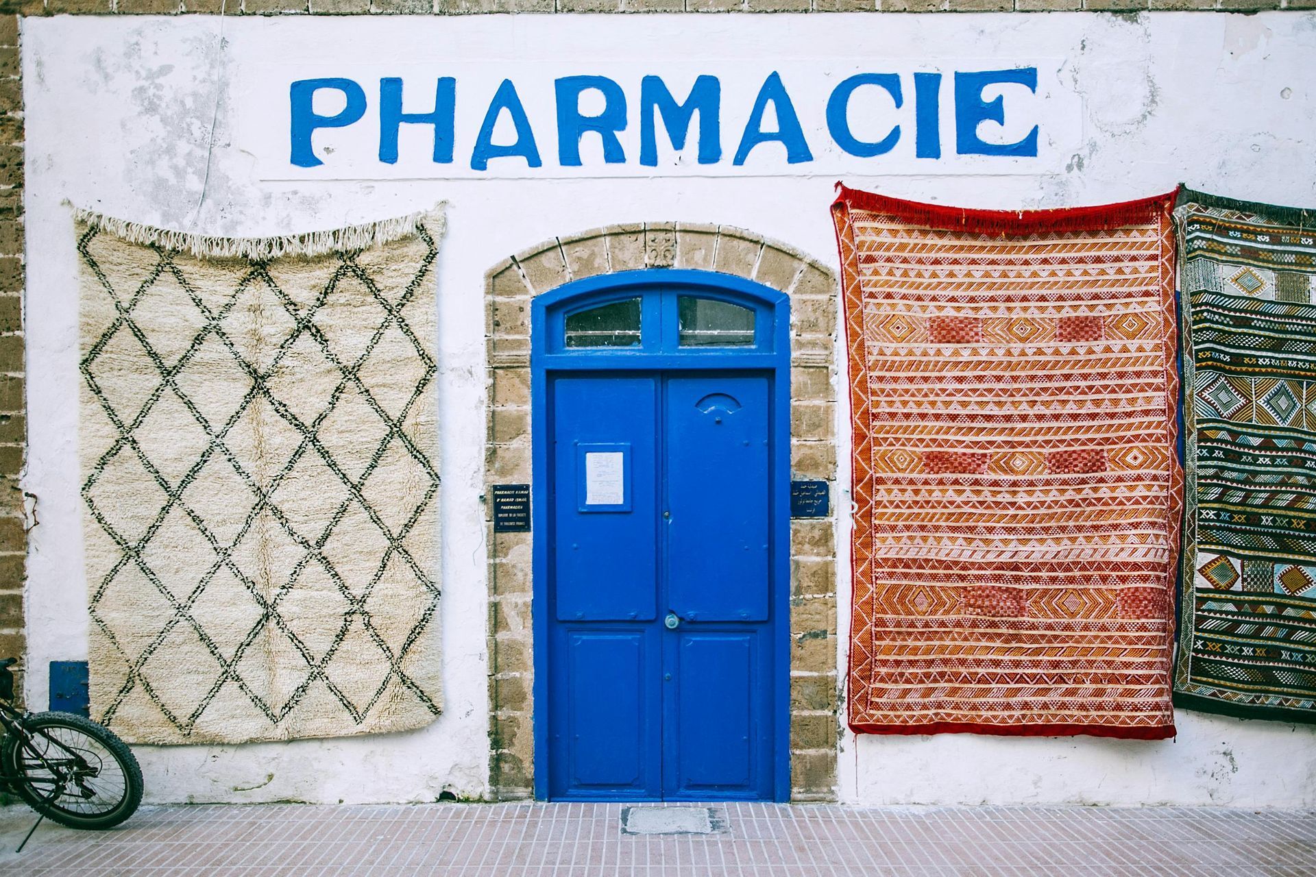 Photo of the exterior of a pharmacy in a French-speaking country.