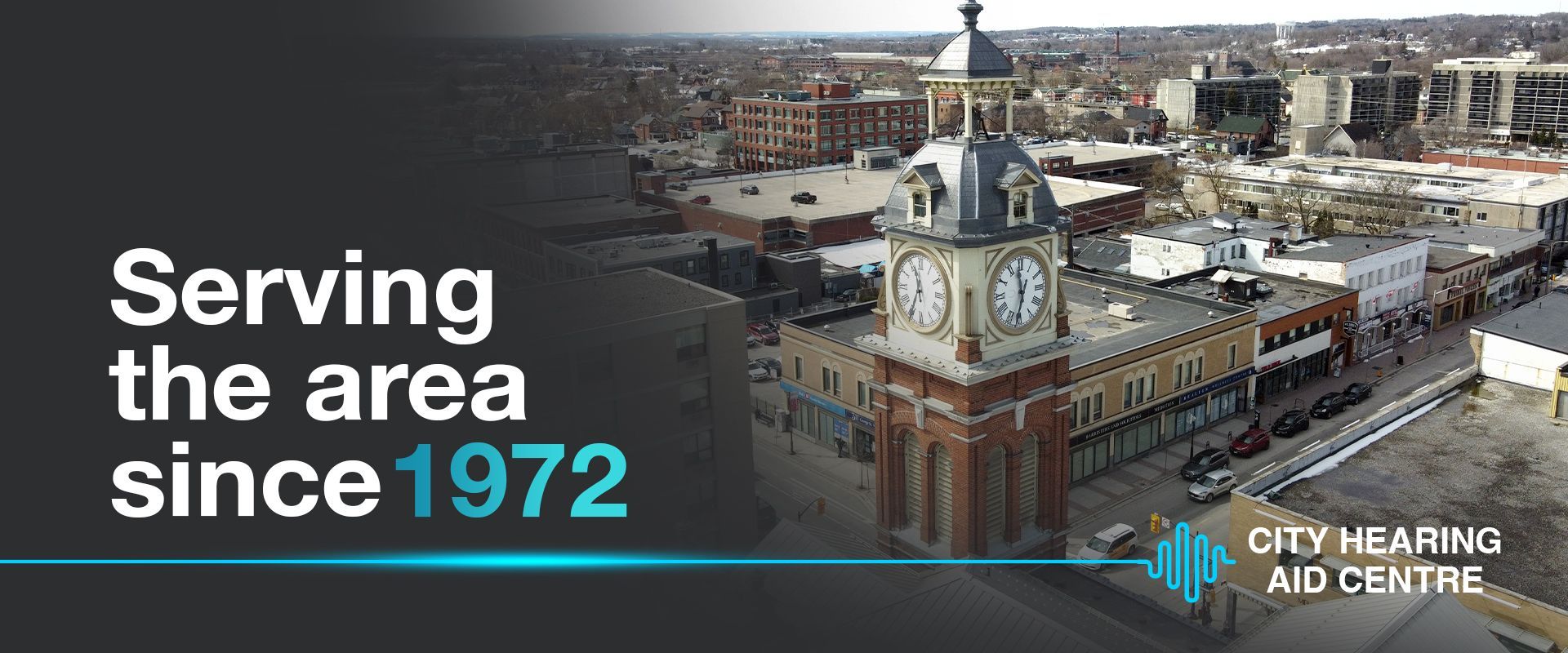 City Hearing Aid Centre advertisement featuring a cityscape with clock tower and text 