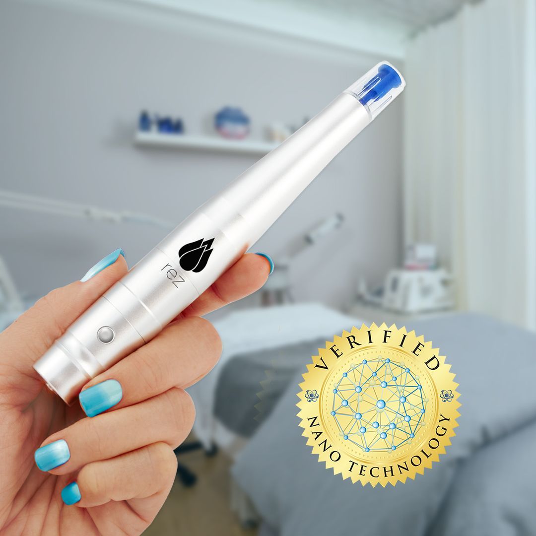 Hand holding white beauty device, clinic background,