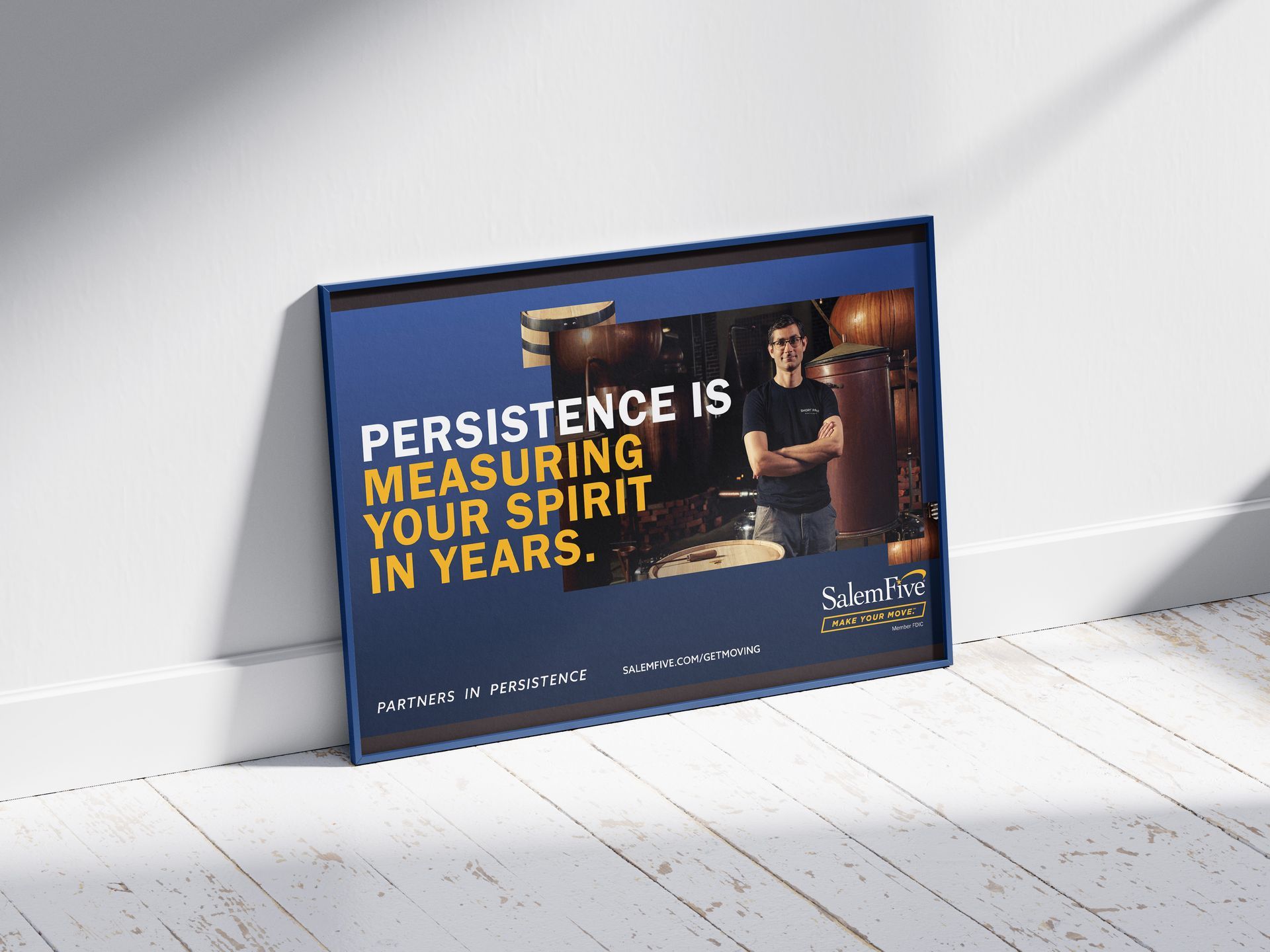 Poster leaning against a wall with text