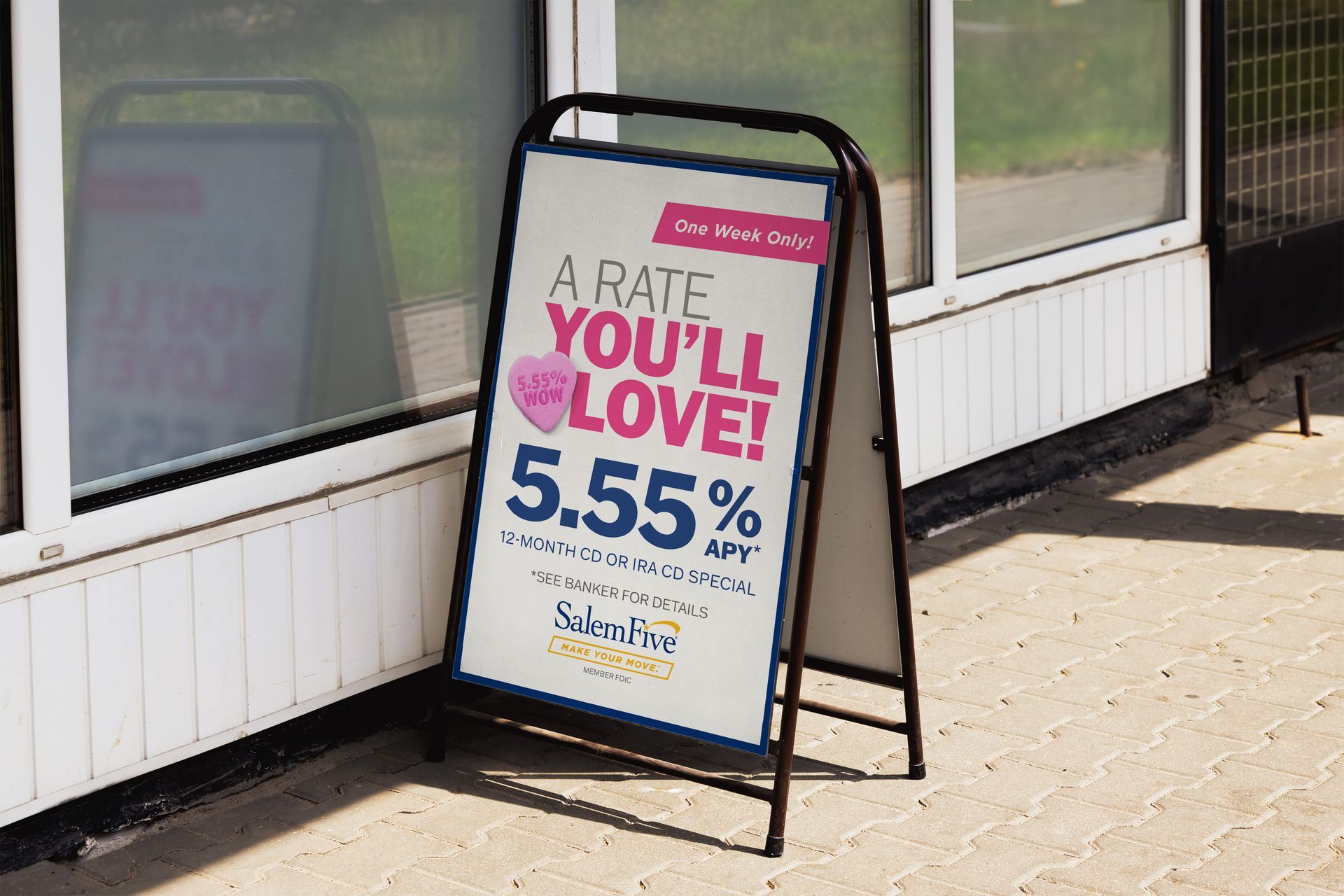 Sandwich board sign: 5.55% interest rate.