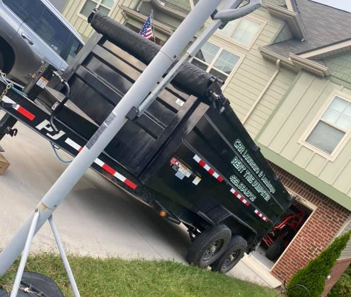 A dump truck is parked in front of a house