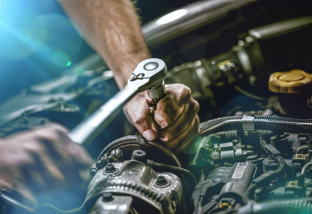 Hand of a Mechanic Repairing Transmission - Mechanic in Coffs Harbour, NSW