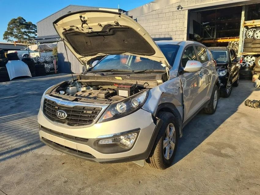 Silver Kia Sportage with Hood Open in A Scrap Yard — Jap Performance T/A All Tuggerah City Auto Dismantlers in Newcastle, NSW