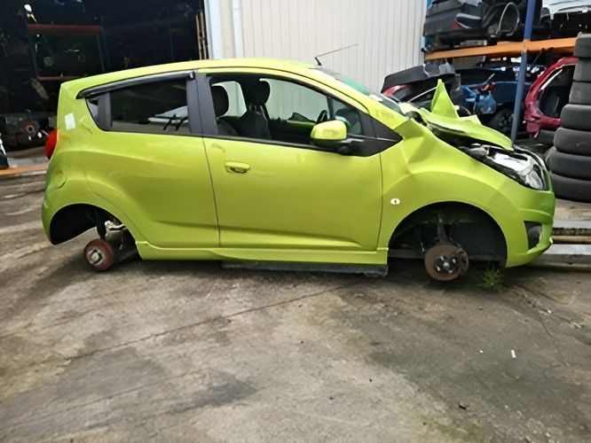 A Lime Green, Chevrolet Spark at A Salvage Yard — Jap Performance T/A All Tuggerah City Auto Dismantlers in Tuggerah, NSW
