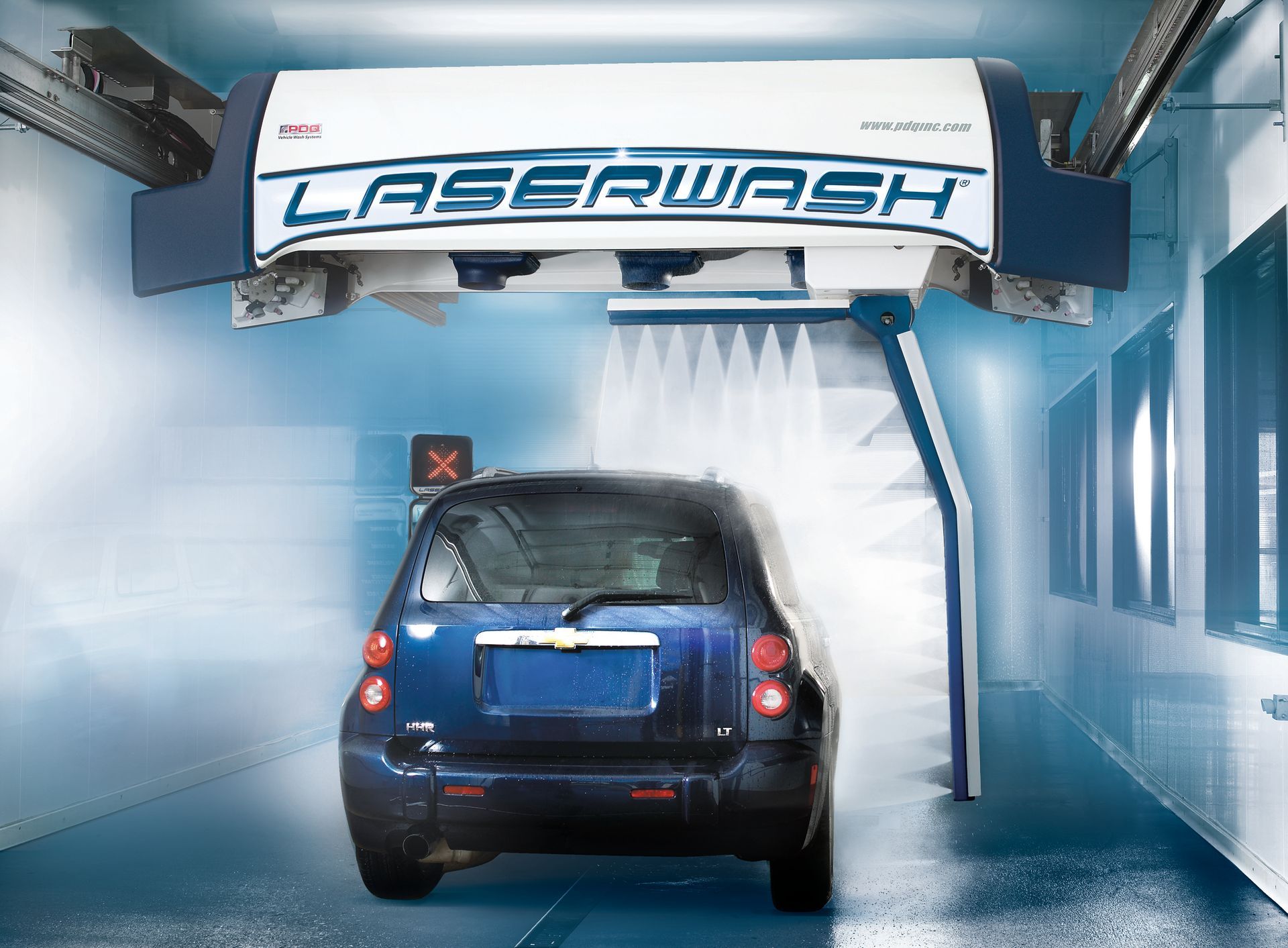 A car is going through a foamy car wash