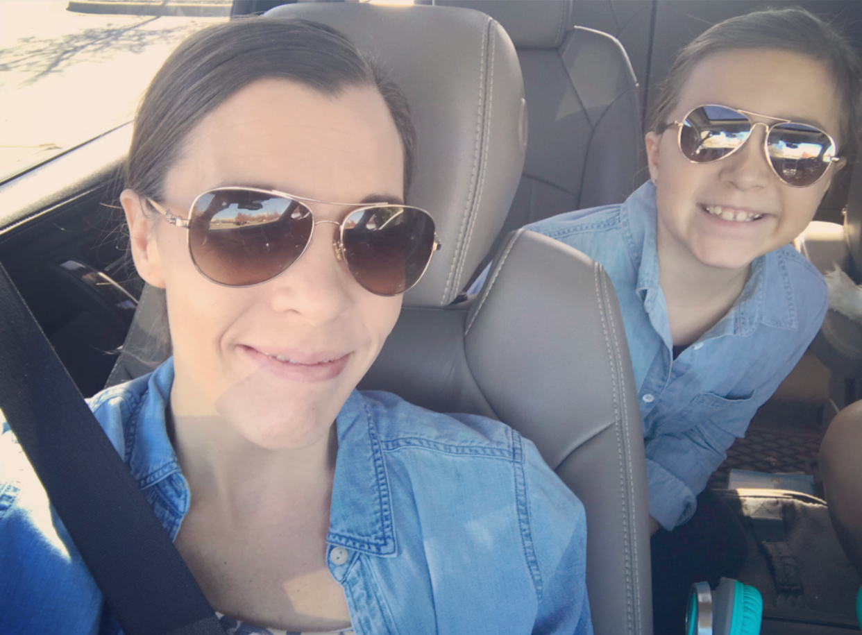 Mom and Ella in SUV with sunglasses on smiling. Black and White selfie style photo