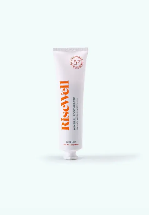 bottle of risewell mineral toothpaste standing up with white background