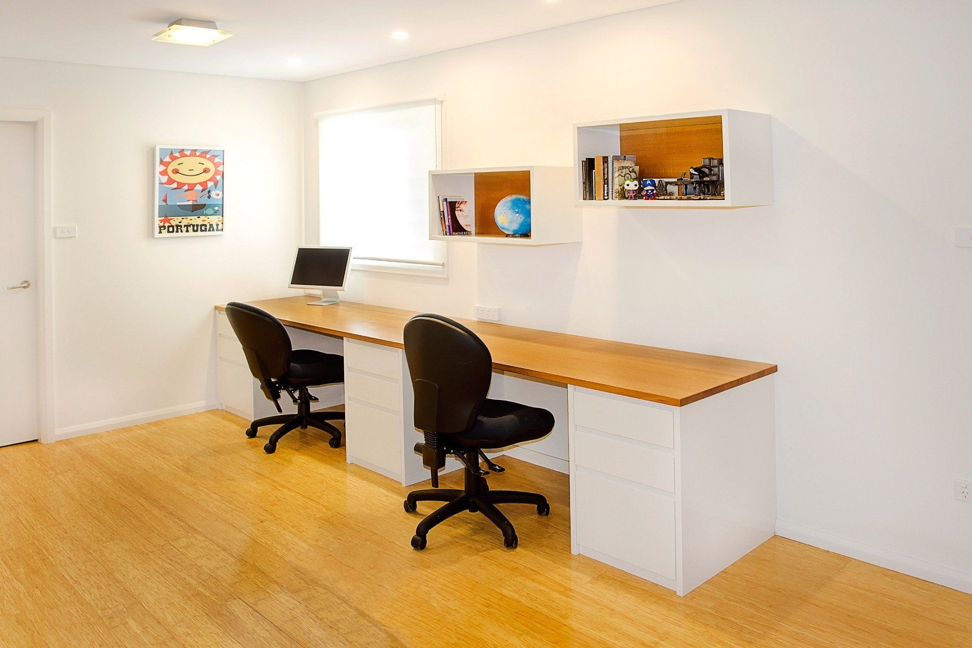A Room with Two Desks and Two Chairs in It — Marlix Custom Timber Furniture Design and Joinery in Unanderra, NSW