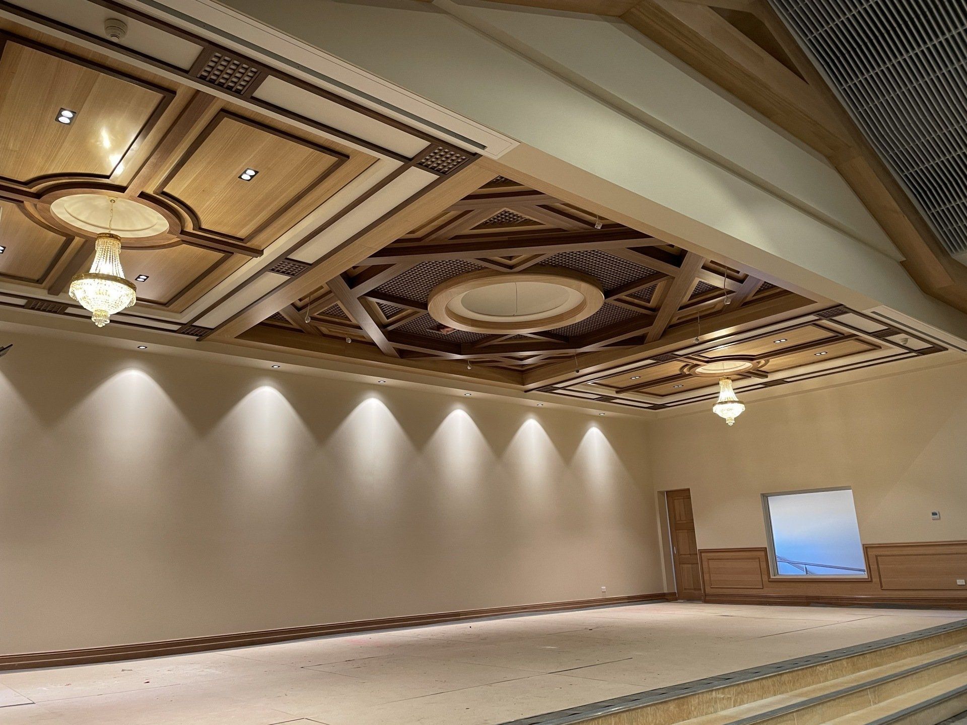 A Large Room with A Wooden Ceiling and Chandeliers — Marlix Custom Timber Furniture Design and Joinery in Unanderra, NSW