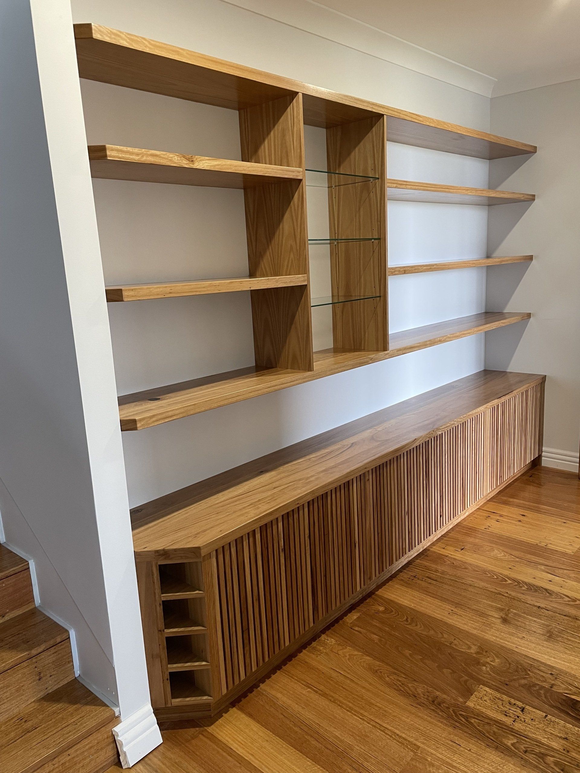 A Room with Wooden Shelves and A Wooden Floor — Marlix Custom Timber Furniture Design and Joinery in Unanderra, NSW