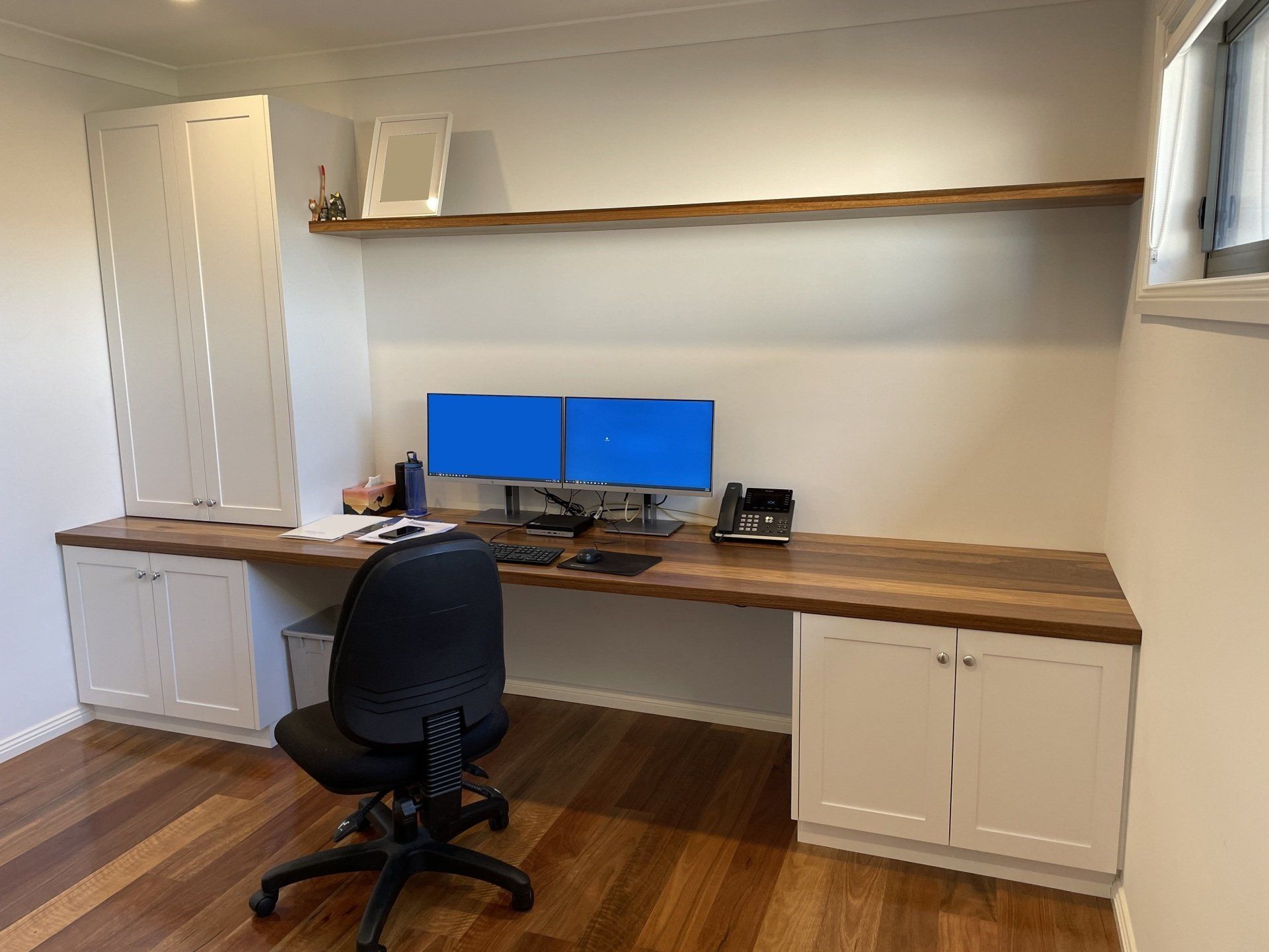 A Home Office with A Desk , Chair , Computer and Two Monitors — Marlix Custom Timber Furniture Design and Joinery in Unanderra, NSW