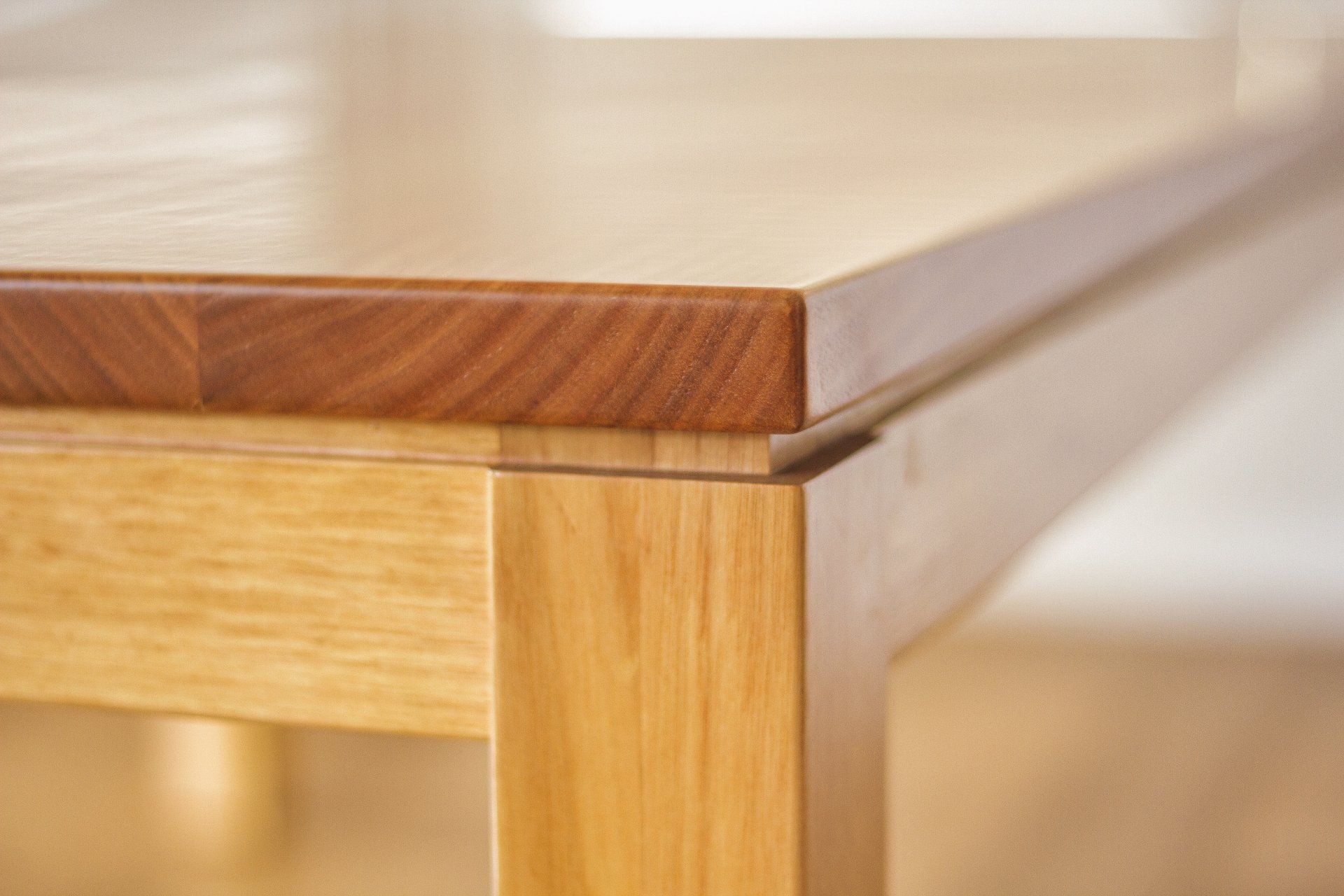 A Close Up Of A Wooden Table With A Wooden Top — Marlix Custom Timber Furniture Design and Joinery in Unanderra, NSW