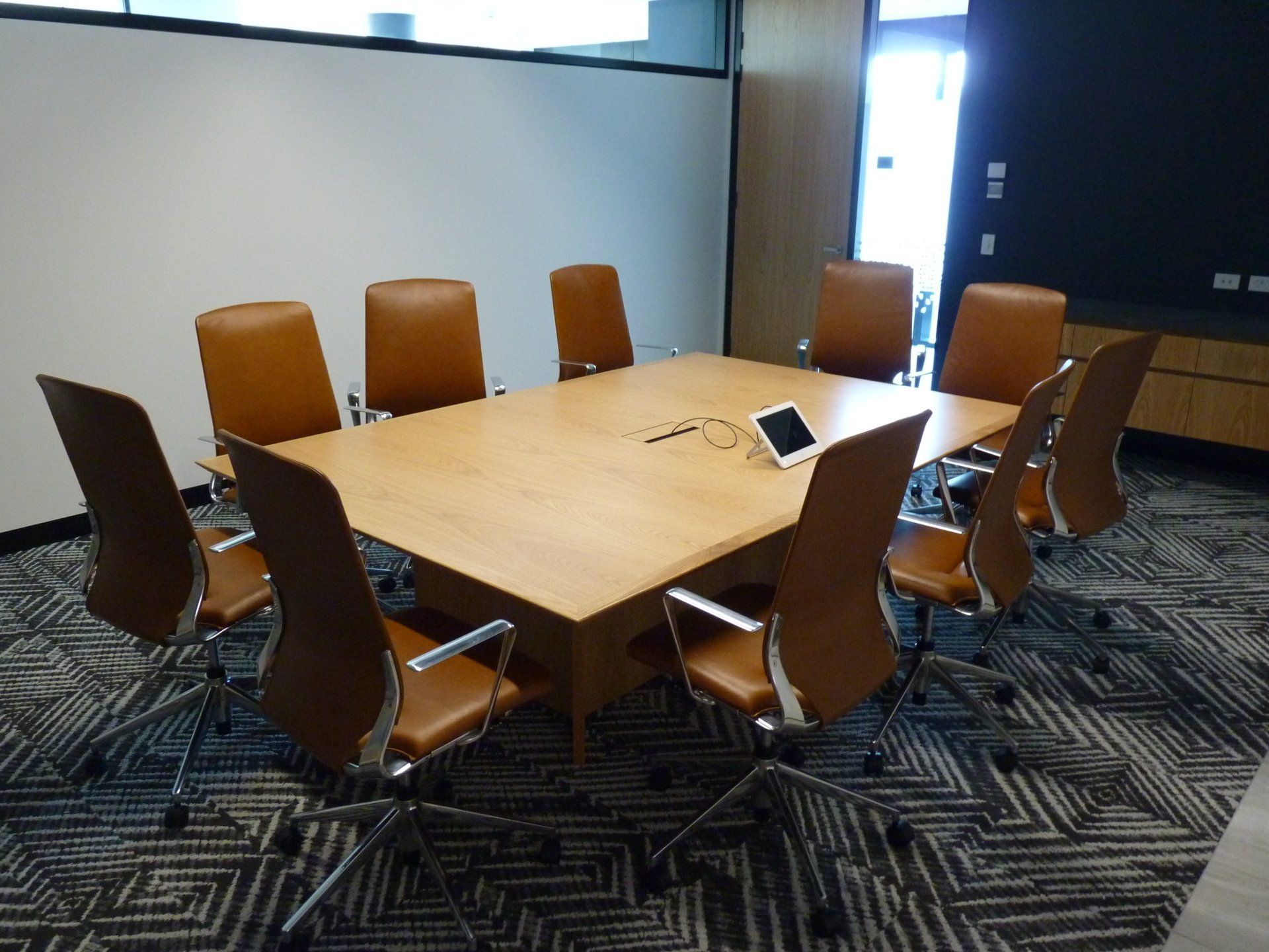 A Conference Room With A Long Table And Chairs — Marlix Custom Timber Furniture Design and Joinery in Unanderra, NSW