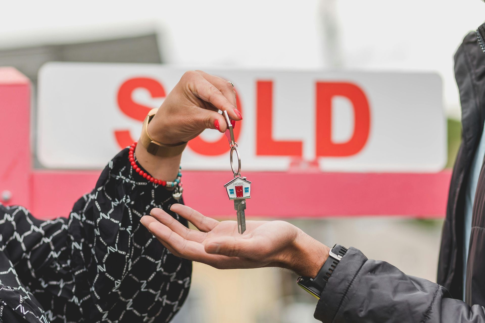handing key over to new homeowner