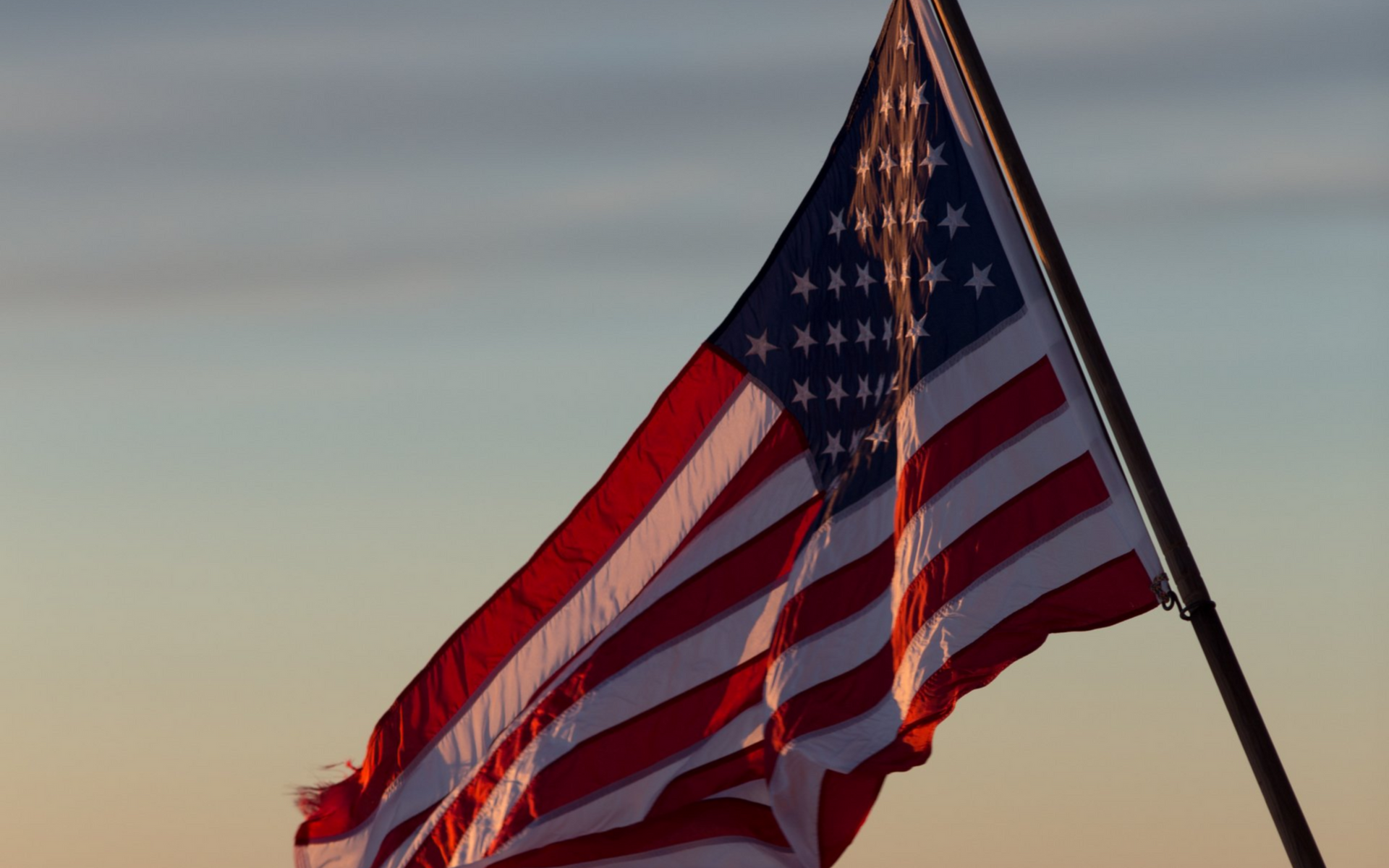 American Flag in front of a sunset American Flag in front of a sunset