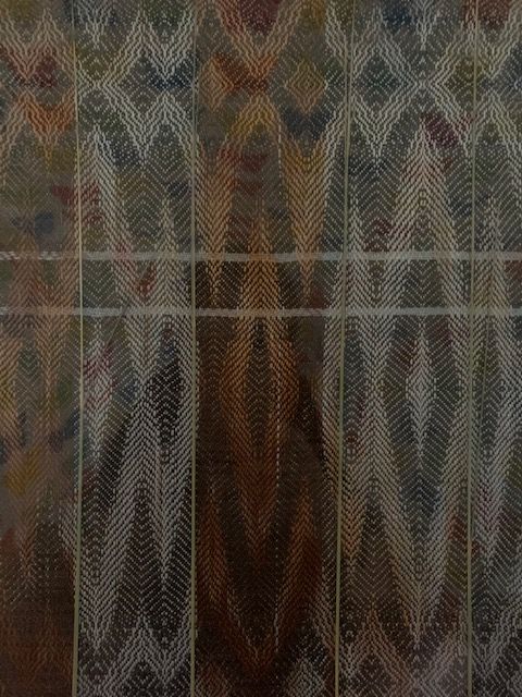 A close up of a Fort Worth weaving with a diamond pattern on it.