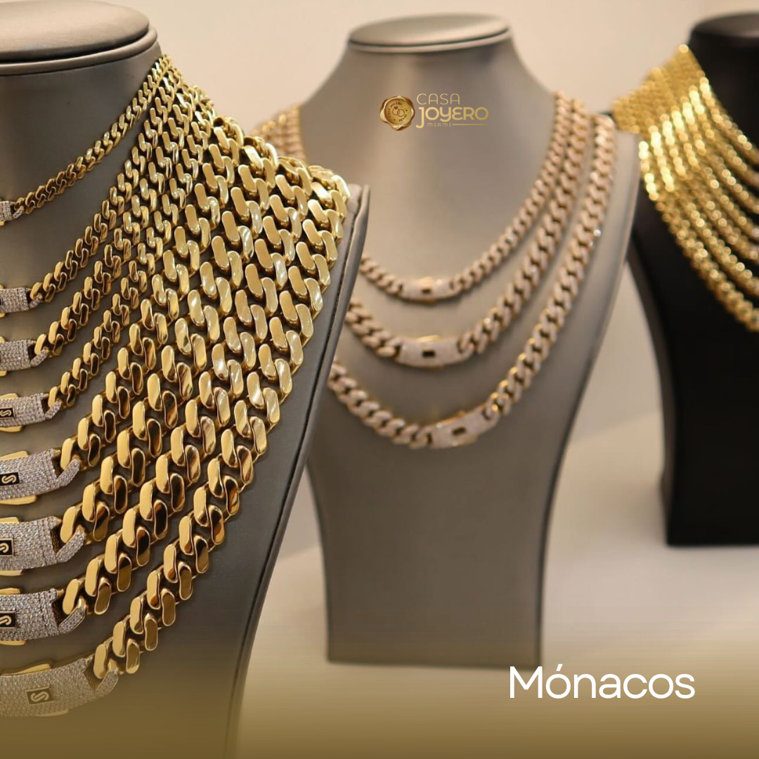 Gold necklaces displayed on mannequins.