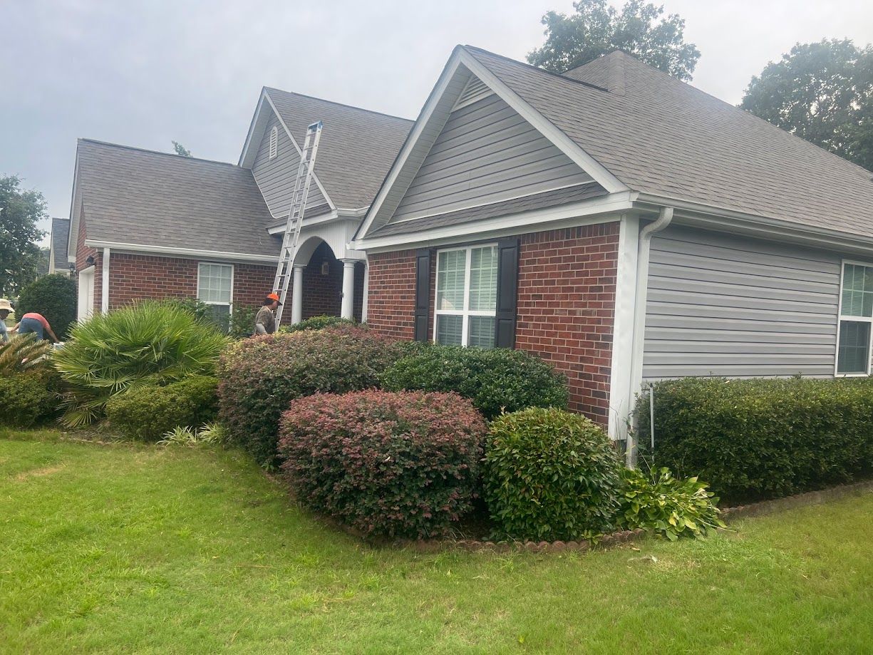 Professional contractor installing a shingle roof.