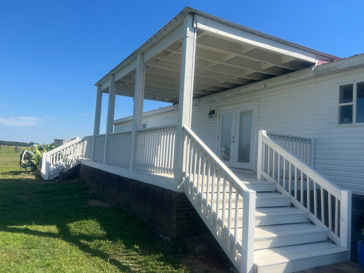 Building contractors installing a white deck.