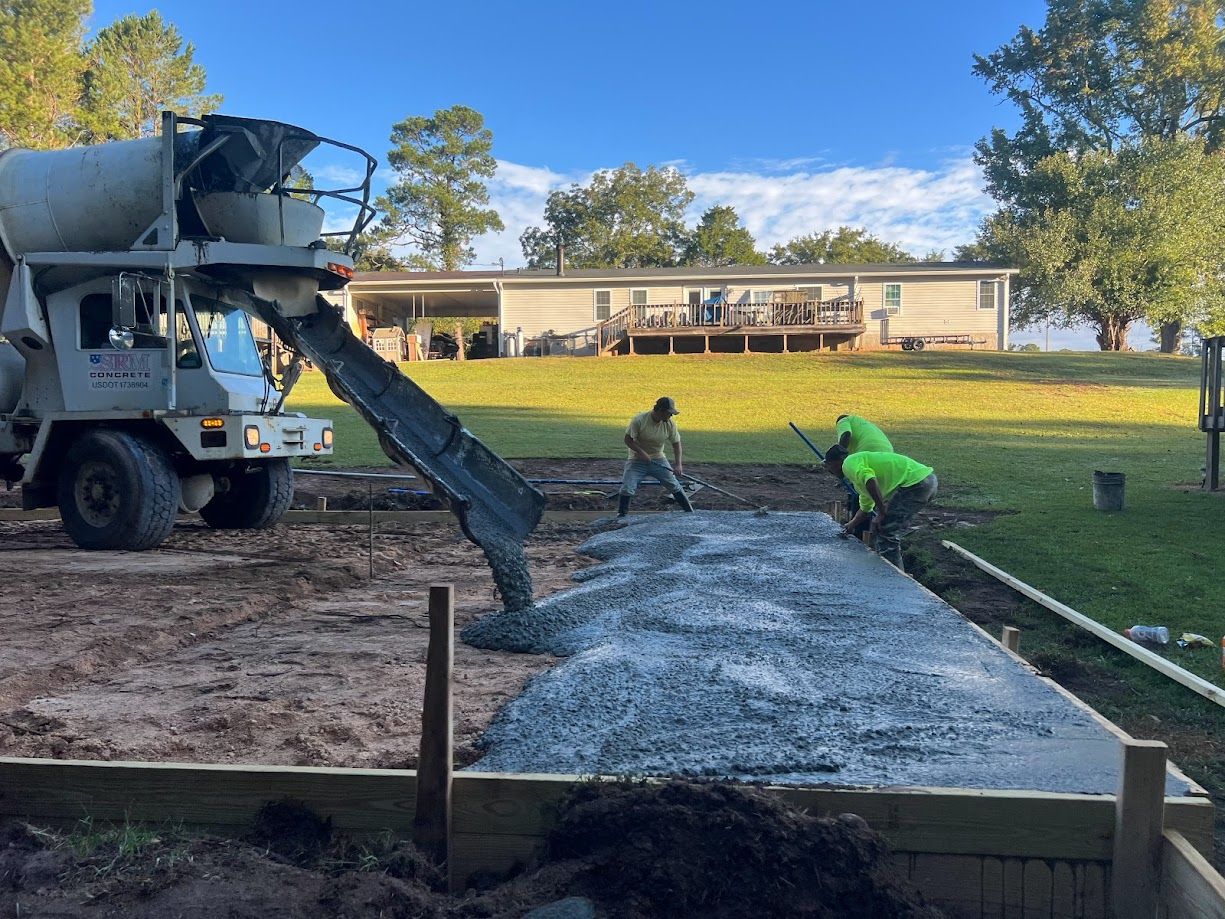 Professional contractors installing concrete.