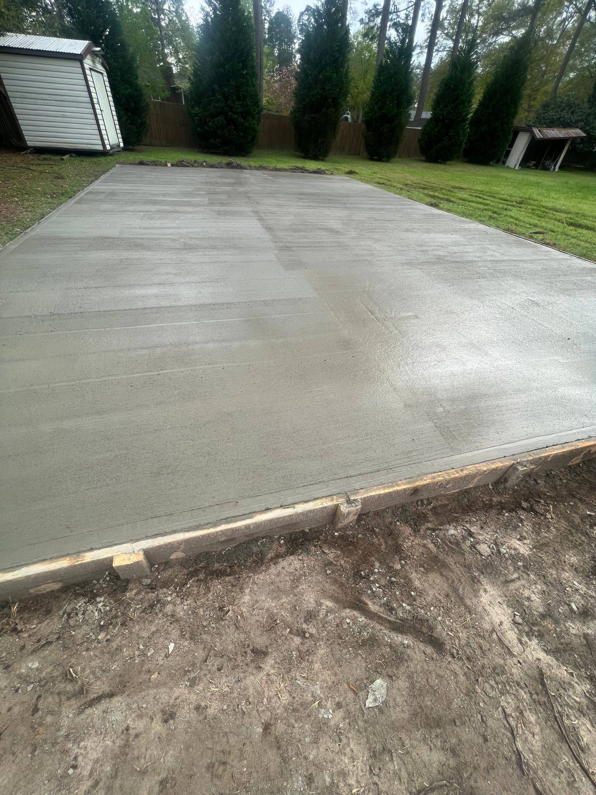 Concrete slab being installed by building contractors.
