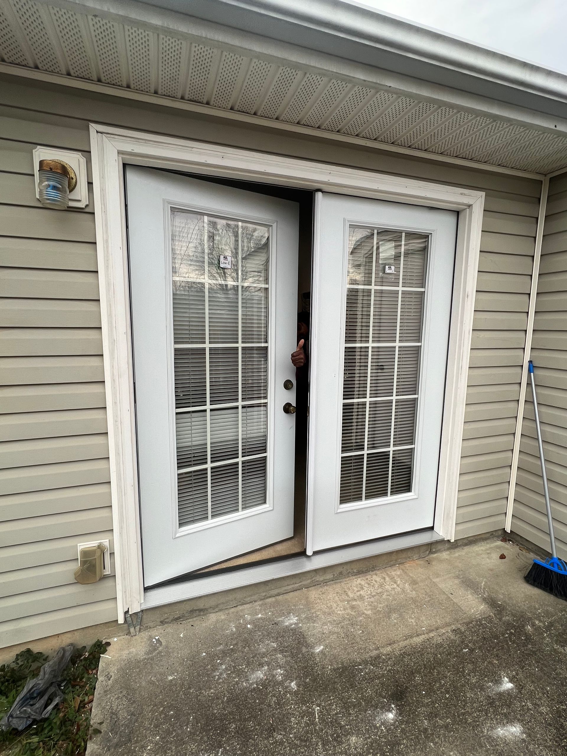 Professional contractor installing doors.