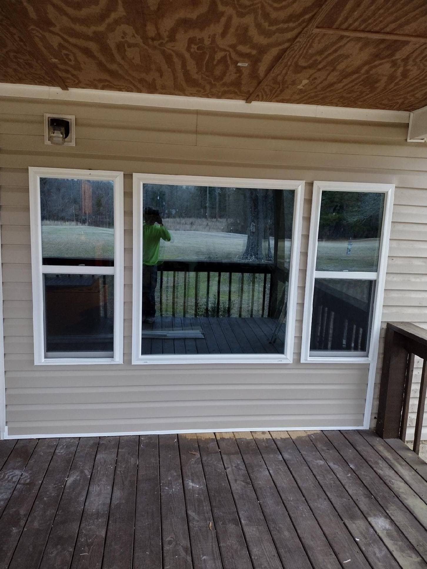 Professional contractor installing windows.
