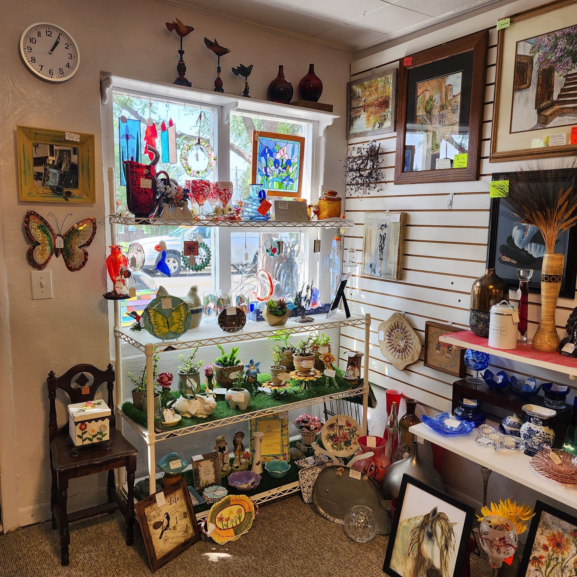 A room filled with lots of decorations and a clock on the wall
