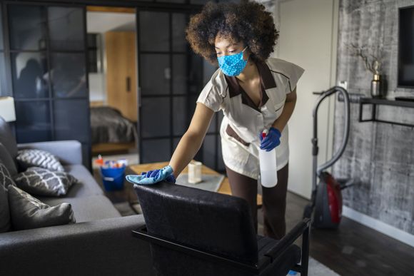 Woman Cleaning The Room — DFW Airport, TX — Spotless