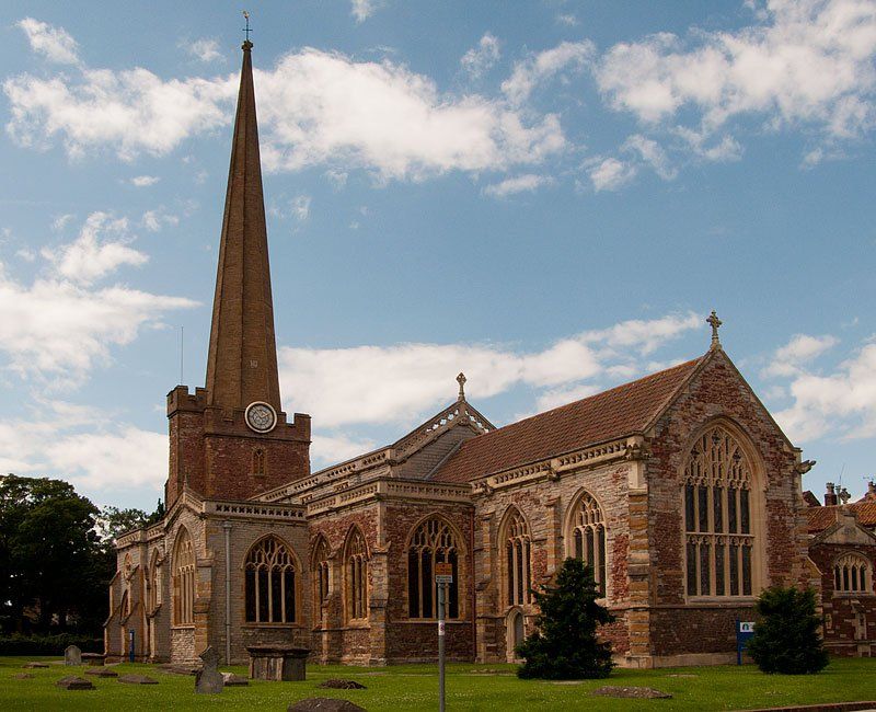Large church building with tall spire and historic architecture