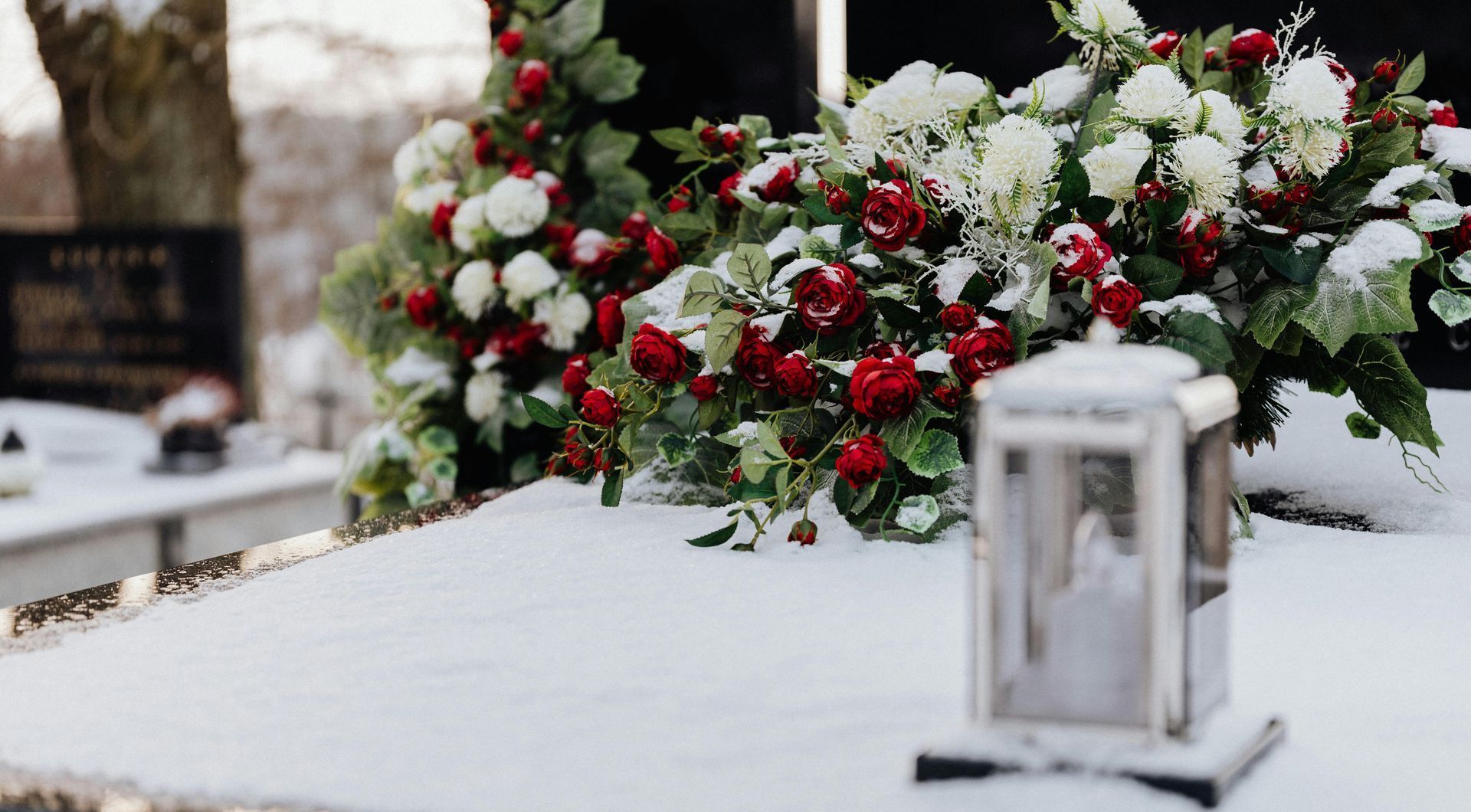 Red roses and white chrysanthemums on a grave
