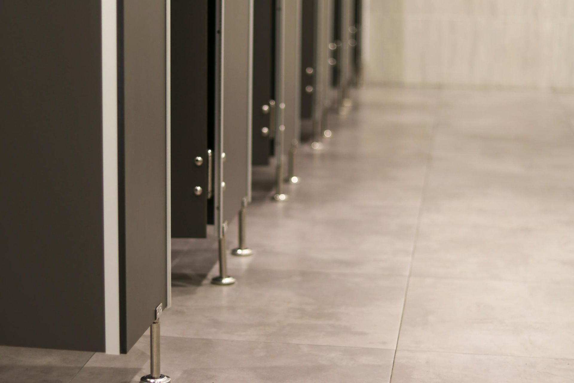 A Row of Toilet Cubicles in a Public Restroom — The Right Toilet Co In Brisbane, NSW