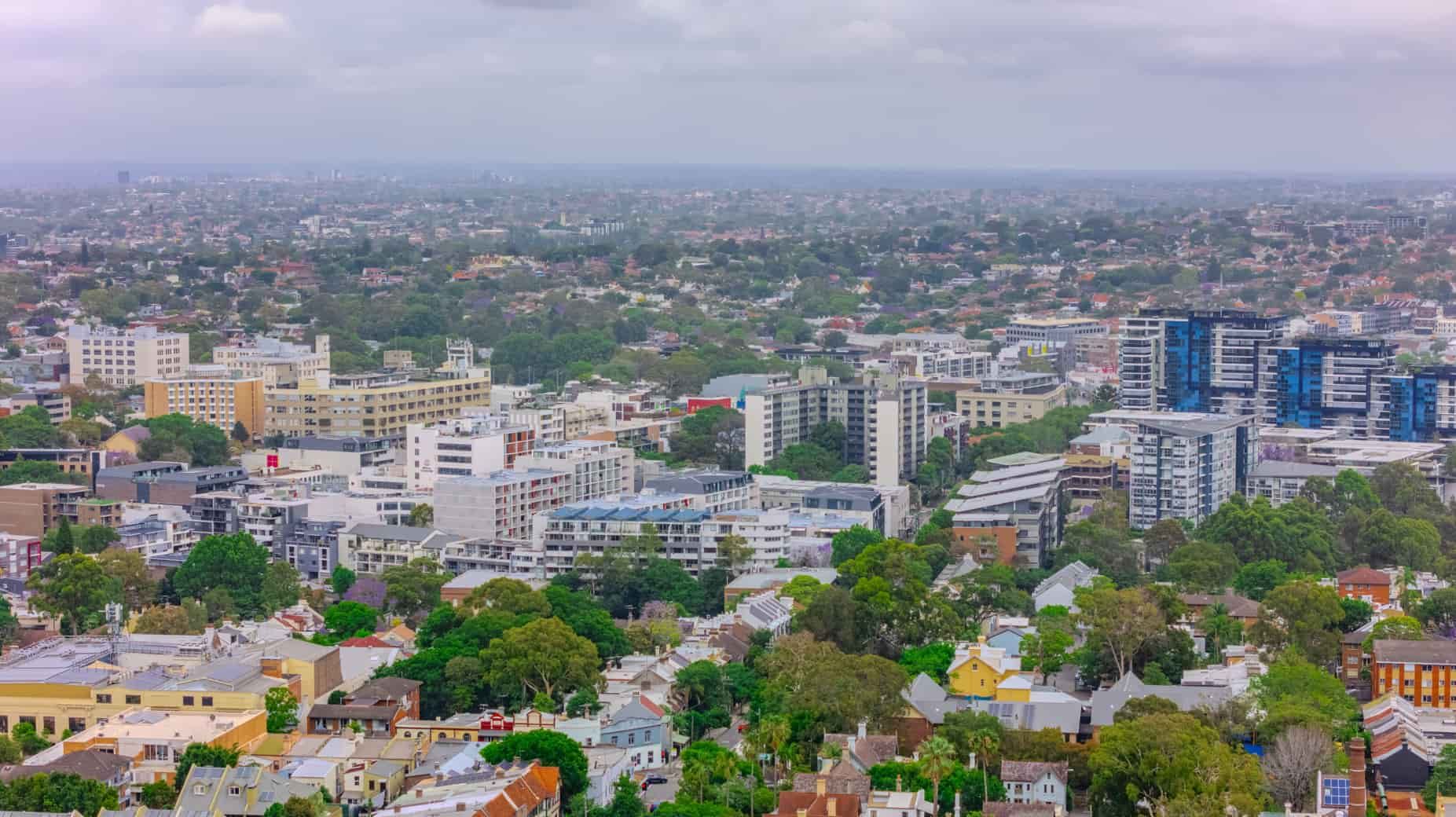 An Aerial View of a City With Lots of Buildings and Trees — The Right Toilet Co In Unanderra, NSW