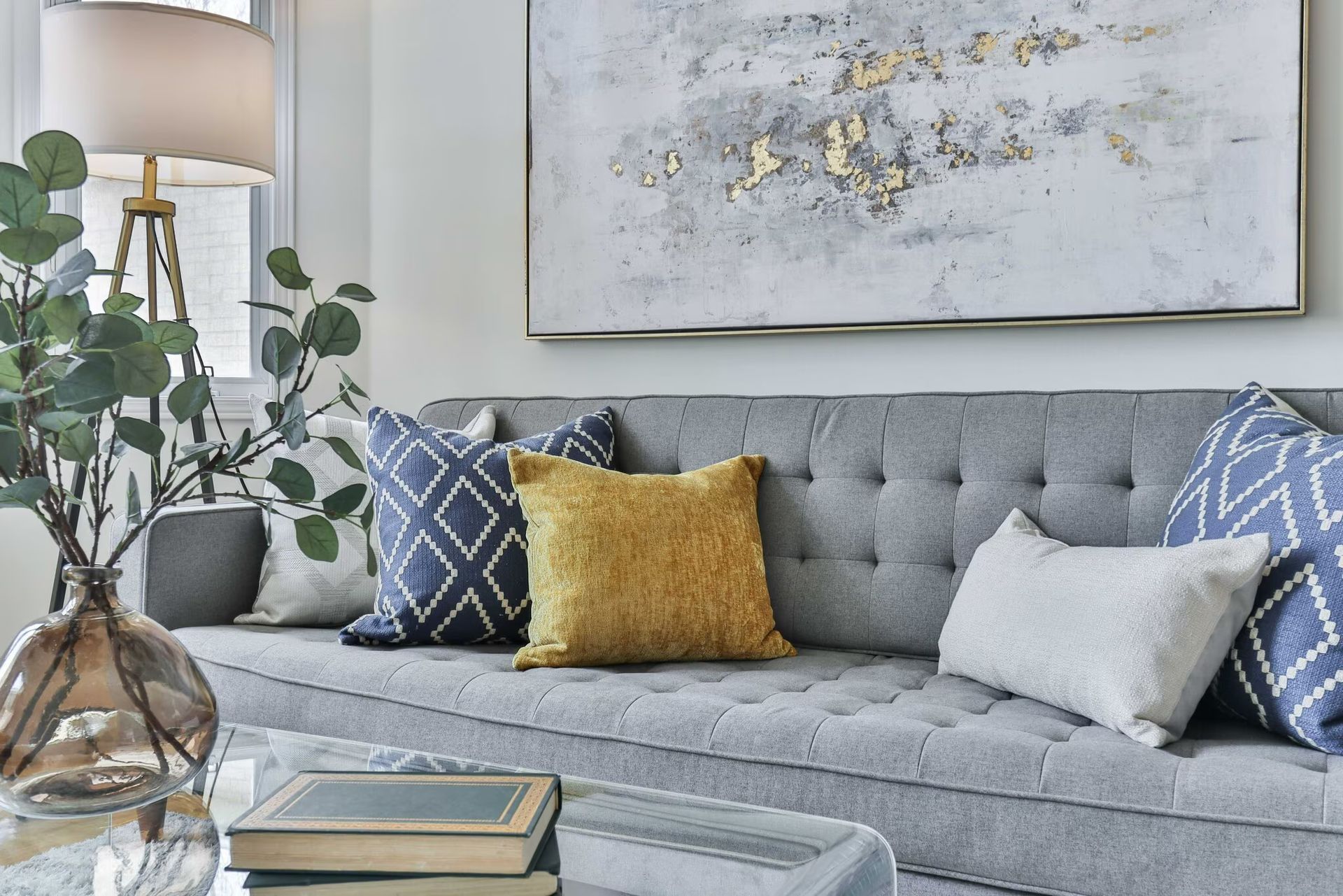 Photo of a couch in a living room with plenty of natural light