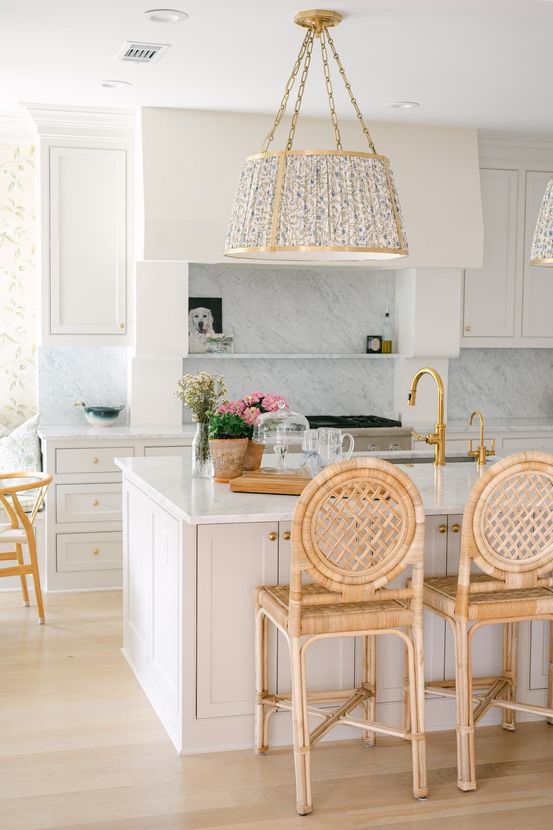A luxury kitchen in Fort Worth with white cabinets and a large island